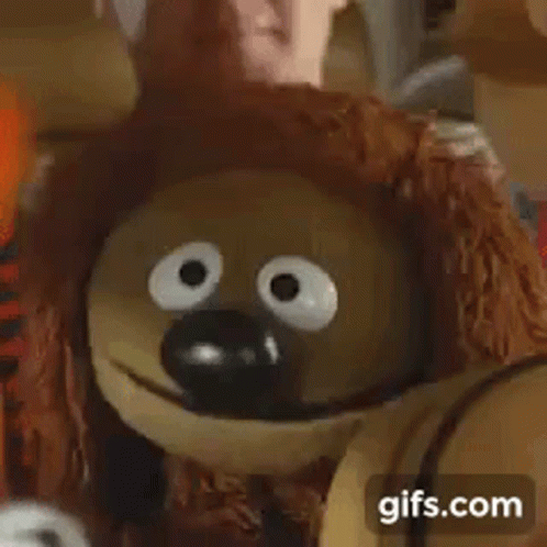 A Close Up Of A Stuffed Animal With Big Eyes And The Words Classic Gifs.com . GIF