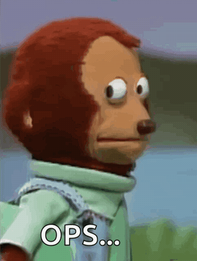 A Close Up Of A Stuffed Monkey With The Words Ops Written On It GIF