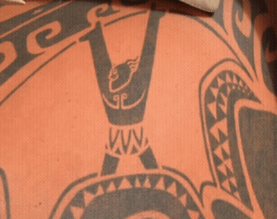 A Close Up Of A Tattoo On A Person 'S Back That Says Vava GIF