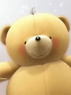 A Close Up Of A Teddy Bear 'S Face With A Tag That Says Tashant GIF