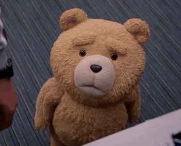 A Close Up Of A Teddy Bear With A Sad Face GIF