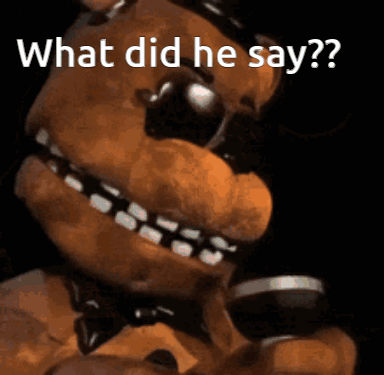 A Close Up Of A Teddy Bear With The Words " What Did He Say " Above It GIF