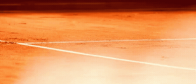 A Close Up Of A Tennis Court With White Lines GIF
