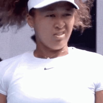 A Close Up Of A Tennis Player Wearing A White Hat And A White Shirt . GIF