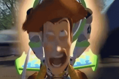 A Close Up Of A Toy Story Character With Buzz Lightyear Behind Him GIF