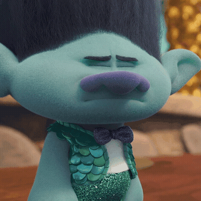 A Close Up Of A Troll With A Bow Tie GIF