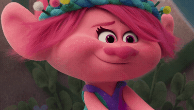 A Close Up Of A Troll With Pink Hair And Purple Eyes GIF