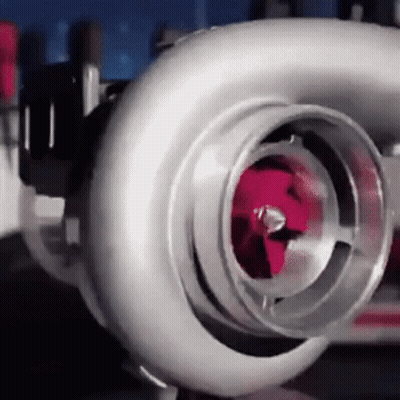 a close up of a turbocharger with a red piston .