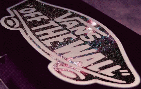 A Close Up Of A Vans Logo On A Purple Surface GIF
