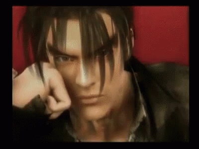 A Close Up Of A Video Game Character 'S Face With A Fist In His Hand . GIF
