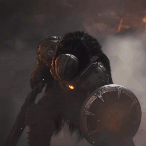 A Close Up Of A Video Game Character 'S Helmet And Armor With The Letters Aa On It GIF