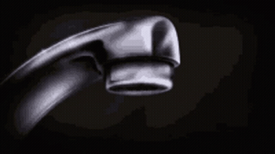 A Close Up Of A Water Faucet With Water Dripping From It . GIF