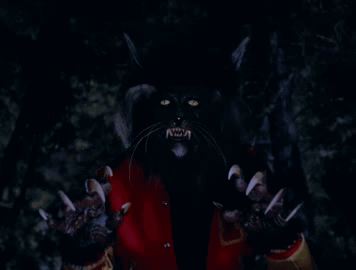 A Close Up Of A Werewolf 'S Claws And Eyes GIF