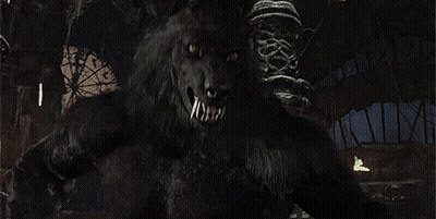 A Close Up Of A Werewolf With Its Mouth Open And Teeth . GIF