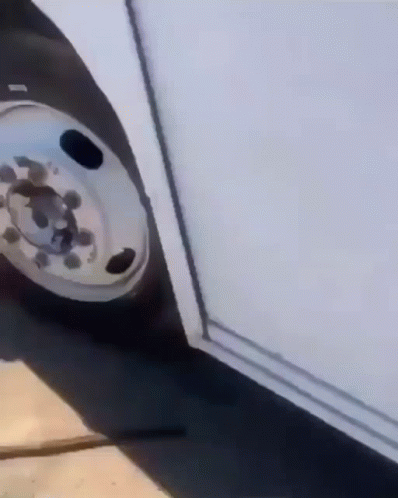 A Close Up Of A Wheel On A Vehicle GIF