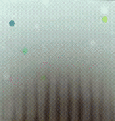 A Close Up Of A White Surface With A Blue And Green Circle On It GIF