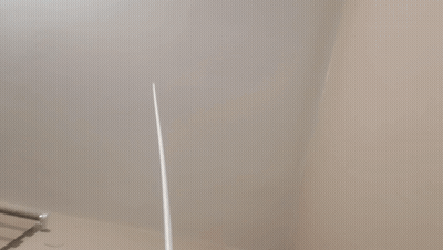A Close Up Of A White Wall With A Towel Rack GIF