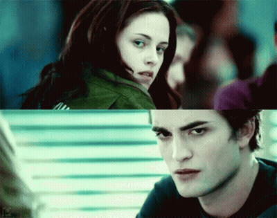 A Close Up Of A Woman And A Close Up Of A Man Looking At Each Other GIF