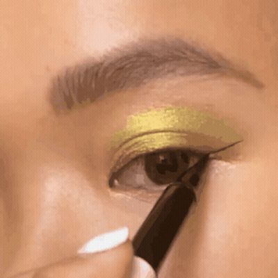 A Close Up Of A Woman Applying Eye Shadow GIF