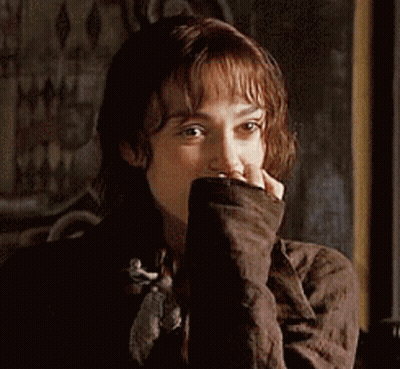 A Close Up Of A Woman Covering Her Face With Her Hands GIF