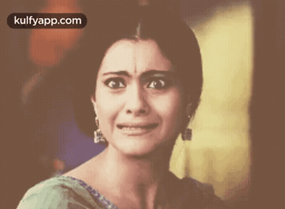 A Close Up Of A Woman Crying With The Words Kulfyapp.com Above Her GIF