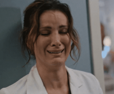 A Close Up Of A Woman In A Lab Coat Crying GIF