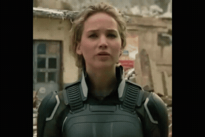 A Close Up Of A Woman In A Military Uniform Standing In Front Of A Building . GIF