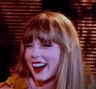 A Close Up Of A Woman Laughing With Her Mouth Open And Red Lips . GIF