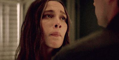 A Close Up Of A Woman Looking At A Man . GIF