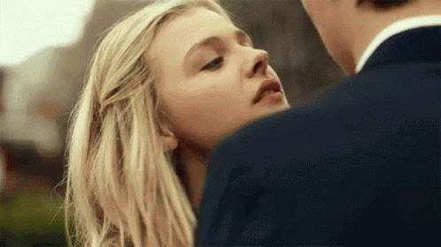 A Close Up Of A Woman Looking At A Man GIF