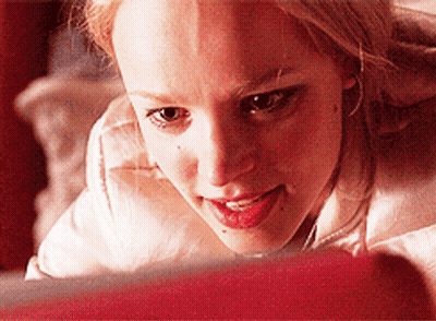 A Close Up Of A Woman Looking At Something GIF