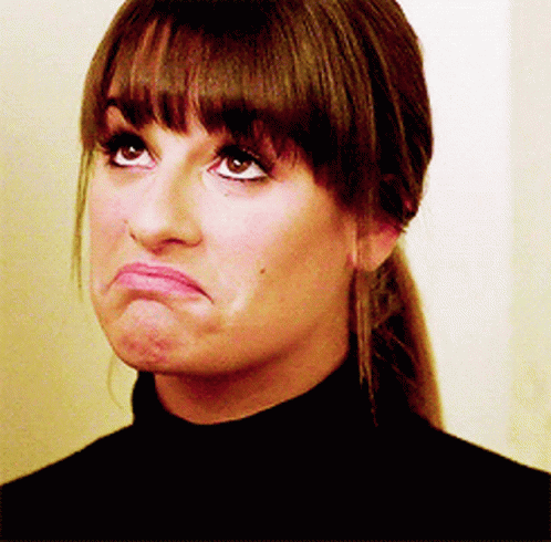 A Close Up Of A Woman Making A Face GIF