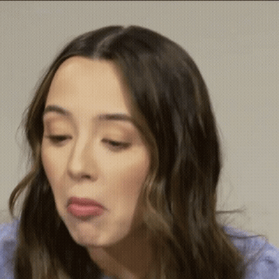 A Close Up Of A Woman Making A Funny Face . GIF