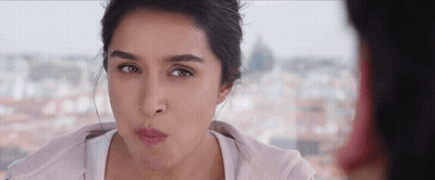 A Close Up Of A Woman Making A Funny Face GIF