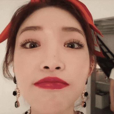 A Close Up Of A Woman Making A Funny Face . GIF