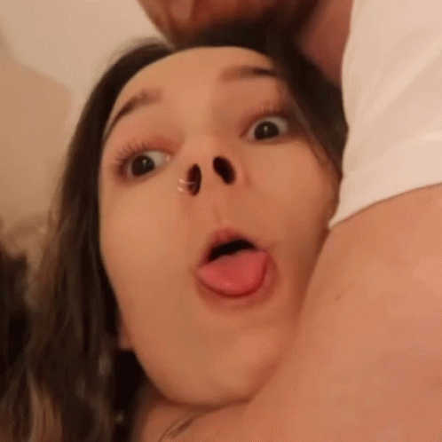 A Close Up Of A Woman Making A Funny Face GIF