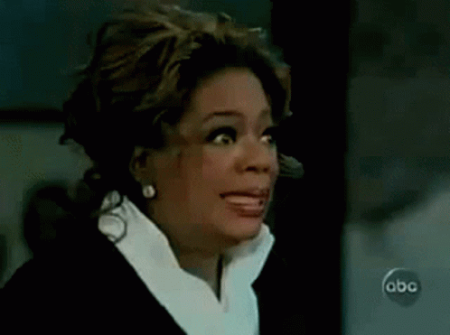 A Close Up Of A Woman Making A Funny Face On A Tv Show . GIF