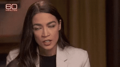 A Close Up Of A Woman Making A Funny Face . GIF