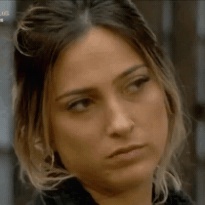 A Close Up Of A Woman Making A Funny Face . GIF