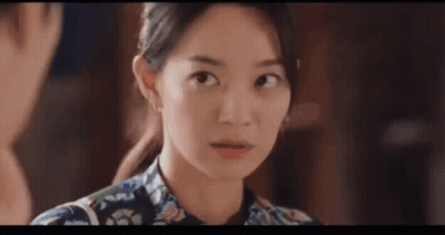 A Close Up Of A Woman Making A Funny Face While Looking At The Camera . GIF
