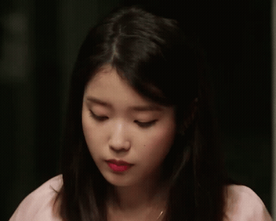 A Close Up Of A Woman Making A Funny Face With Her Mouth Open GIF