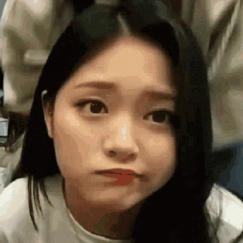 A Close Up Of A Woman Making A Funny Face With Her Mouth Open . GIF