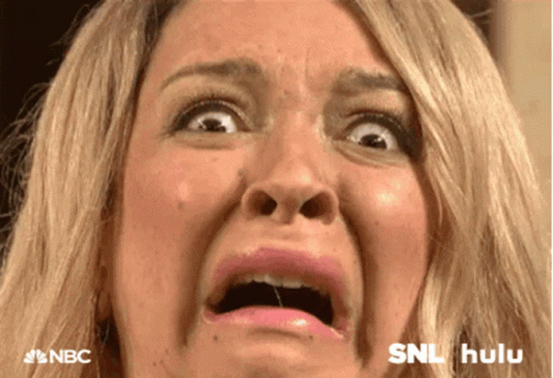 A Close Up Of A Woman Making A Funny Face With Nbc And Hulu Logos In The Background GIF
