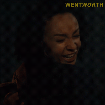 A Close Up Of A Woman Making A Funny Face With The Word Wentworth Behind Her GIF