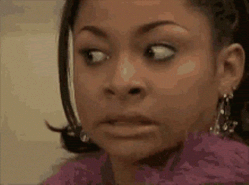 A Close Up Of A Woman Making A Surprised Face . GIF