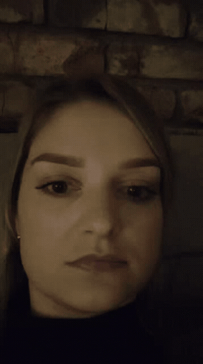 A Close Up Of A Woman Making A Surprised Face GIF