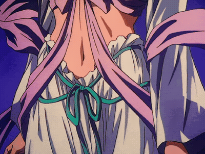 A Close Up Of A Woman 'S Back With A Purple And Green Ribbon Around Her Waist GIF