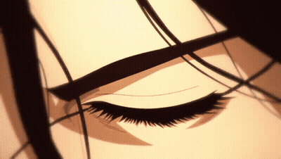 A Close Up Of A Woman 'S Eye With A Black Eye Shadow GIF