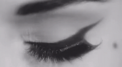 A Close Up Of A Woman 'S Eye With Eyeliner On It . GIF