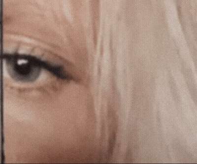 A Close Up Of A Woman 'S Eye With The Words Surprised And Not Surprised GIF
